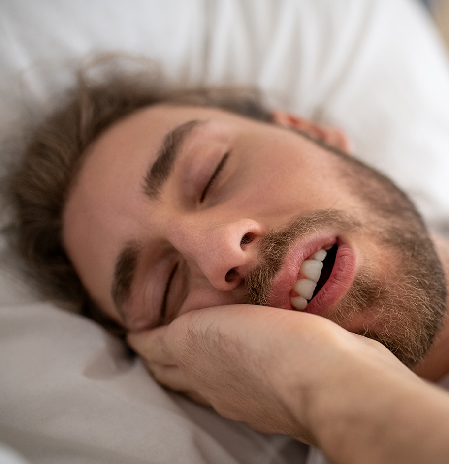 Up close of man snoring.